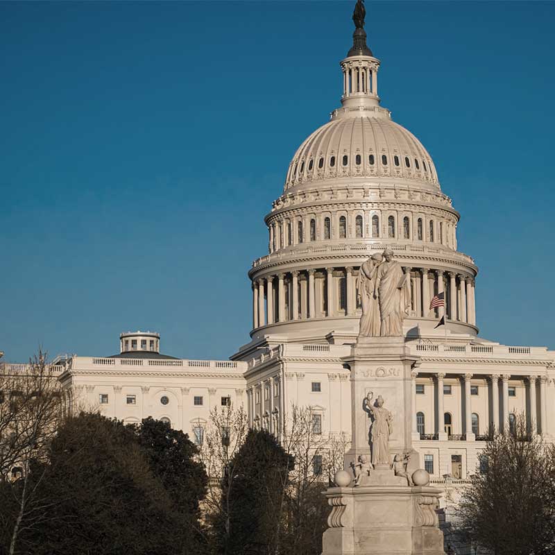 The Washington DC Capitol Building against a clear blue sky.